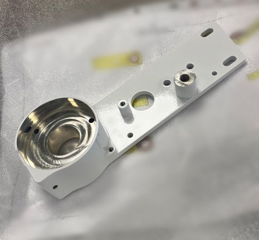 CNC Machined Actuation Component Showing Machined Bores, Raised Features and Multiple Mounting Points CNC machined actuation component showing machined bores, raised features and multiple mounting points