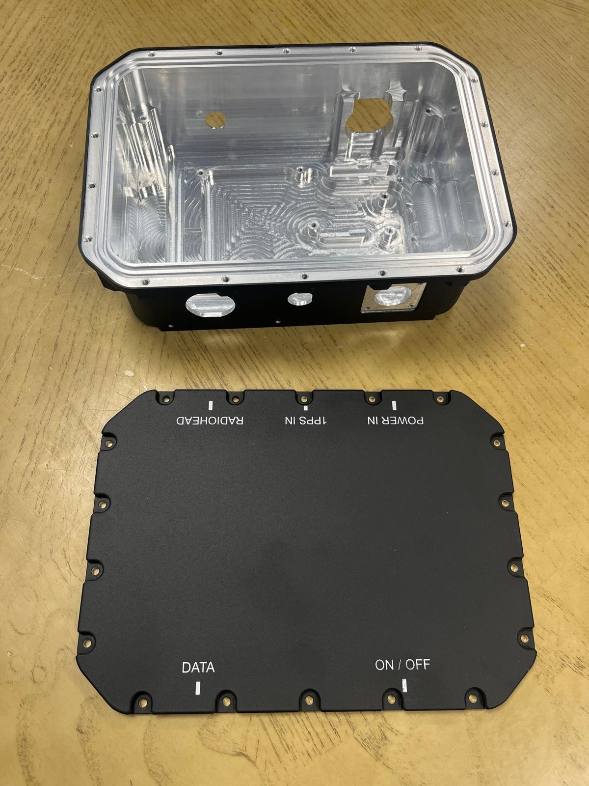 Machined enclosure before final assembly with the matt black lid and controlled external finish